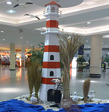 Centerdekoration mit Leuchtturm © Barbaras Dekoservice